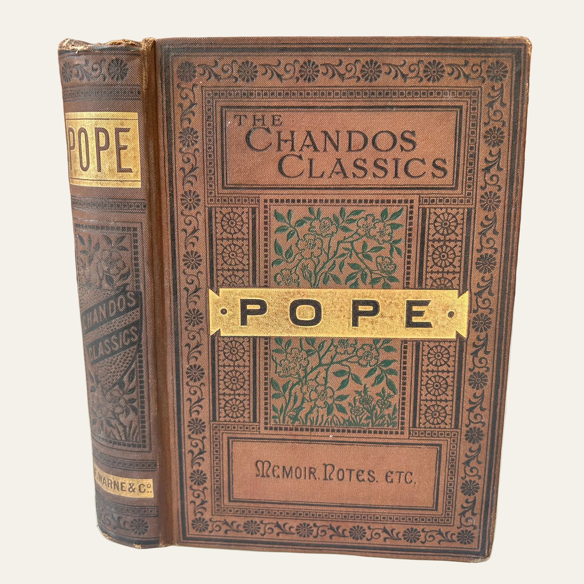 Vintage book titled 'The Chandos Classics' by Pope on a wooden surface.