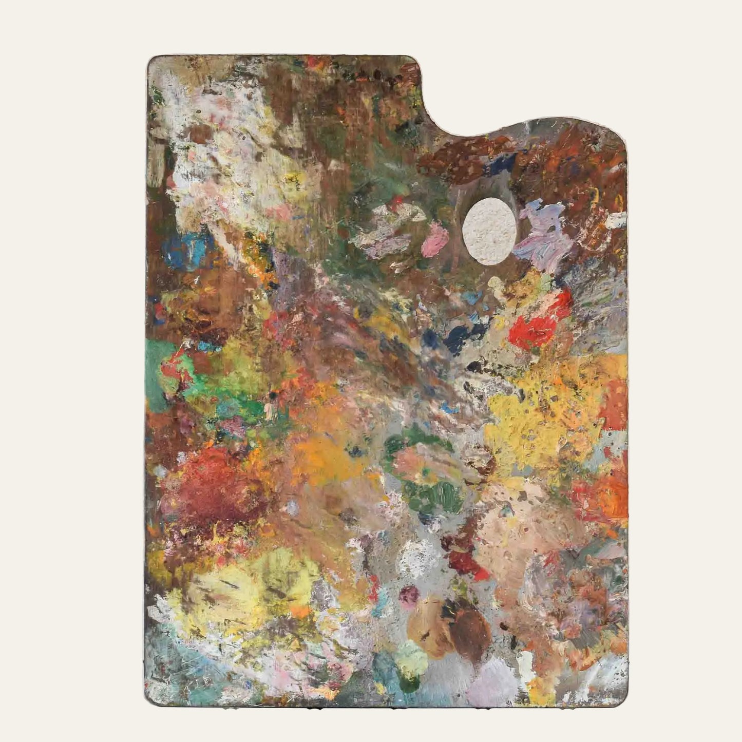 Artistic paint palette with multicolored textures on a light background