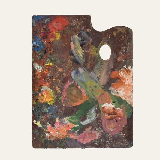 Artistic depiction of a figure with flowers on an artist's palette