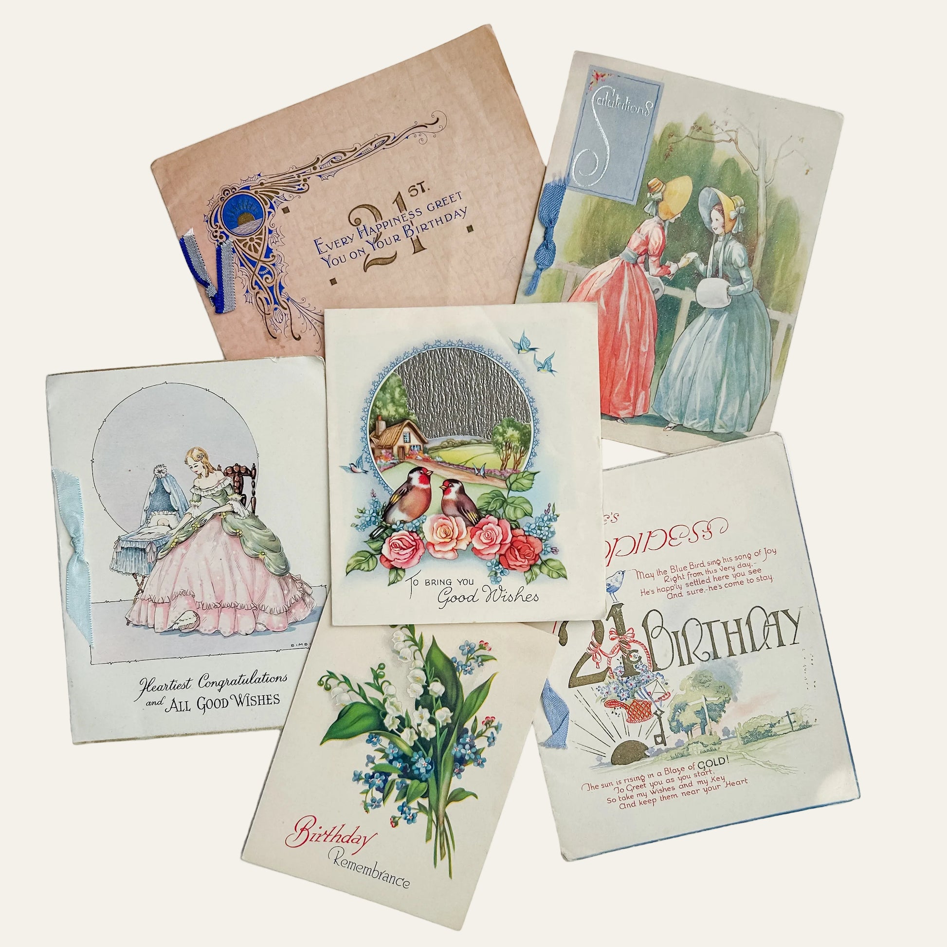Collection of vintage birthday cards on a textured surface