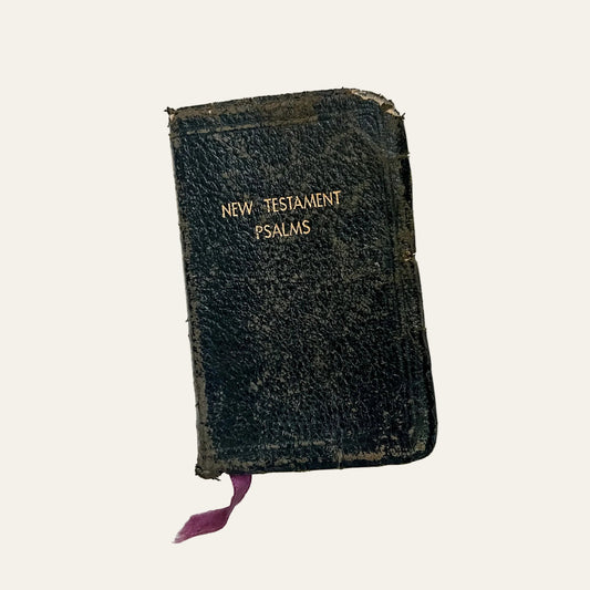 Vintage New Testament Psalms book on a textured white surface